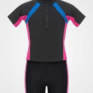 Front view product shot of a kids' black short-sleeve wetsuit on a hanger. The top features blue diagonal shoulder panels, pink sleeve and side panels, a mock collar, and a front zipper. The matching black swim shorts have pink side stripes. Displayed on a clean white background.
