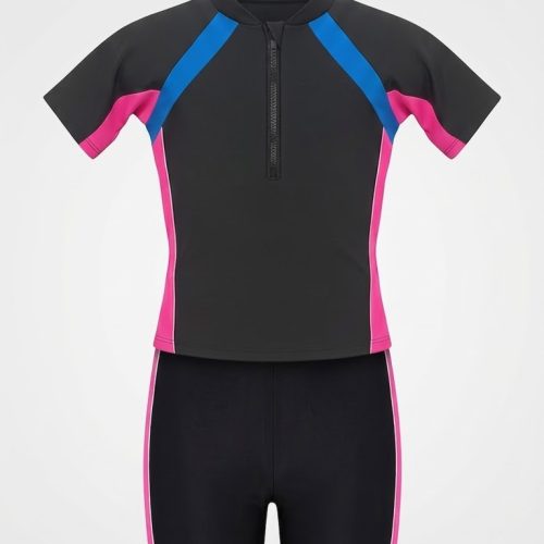 Front view product shot of a kids' black short-sleeve wetsuit on a hanger. The top features blue diagonal shoulder panels, pink sleeve and side panels, a mock collar, and a front zipper. The matching black swim shorts have pink side stripes. Displayed on a clean white background.